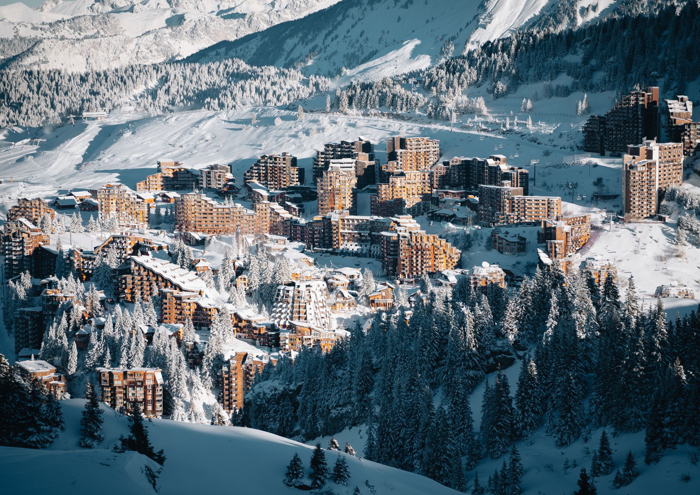 Aerial view of Avoriaz ski slopes in the Portes du Soleil with the Swiss Alps in the background